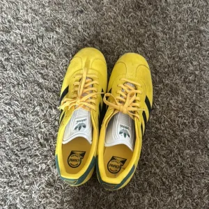 Adidas Yellow and Black Low-Top Sneakers with White Sole