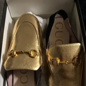 Gucci Gold Flats with Iconic Horsebit Detail