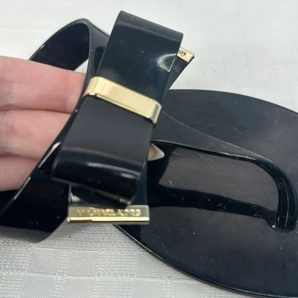 Michael Kors Kayden Jelly Bow Tie Thong Sandals in Black. Size 10.