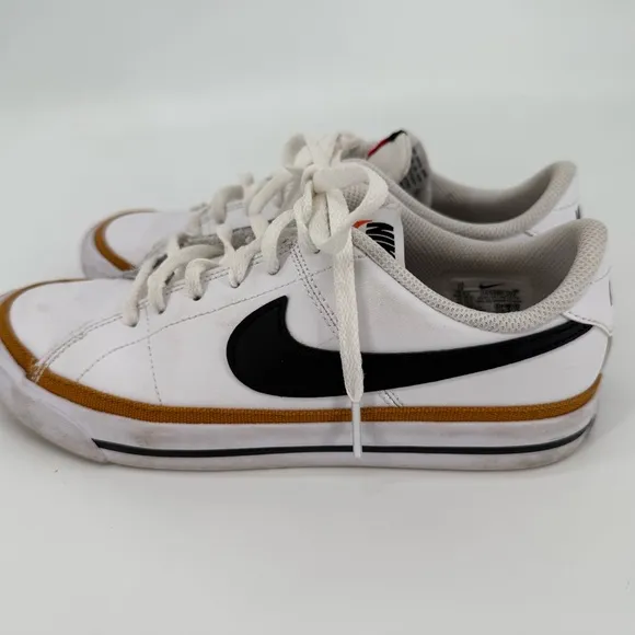 Nike White and Black Sneakers with Prominent Swoosh and Comfortable Midsole