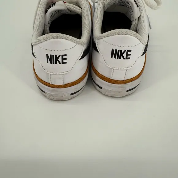 Nike White and Black Sneakers with Prominent Swoosh and Comfortable Midsole