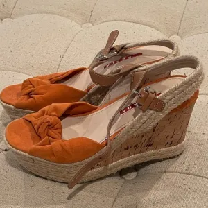 Prada women’s orange suede wedge sandals with cork wedge