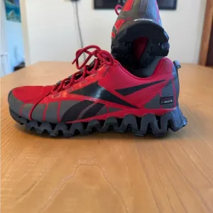 Reebok Red and Black Sneakers with Breathable Mesh and Zigzag Sole