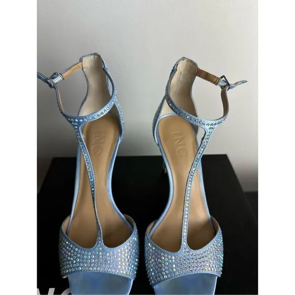 Subtle sparkle tops elegant T-straps and a gorgeous lift in the Firah sandals fr
