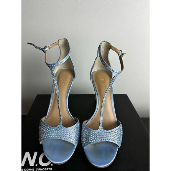 Subtle sparkle tops elegant T-straps and a gorgeous lift in the Firah sandals fr