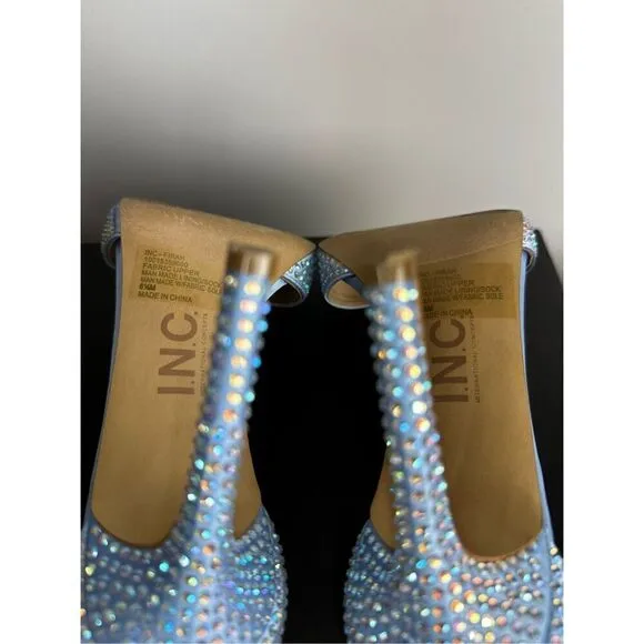 Subtle sparkle tops elegant T-straps and a gorgeous lift in the Firah sandals fr