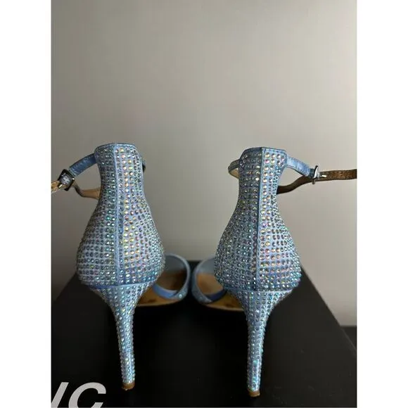 Subtle sparkle tops elegant T-straps and a gorgeous lift in the Firah sandals fr