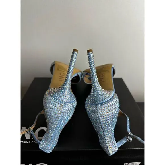Subtle sparkle tops elegant T-straps and a gorgeous lift in the Firah sandals fr
