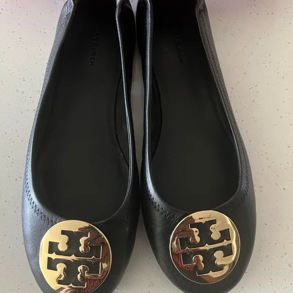 Tory Burch Black and Gold Loafers with Iconic Medallion