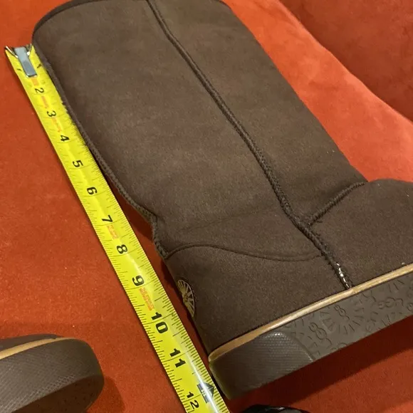 UGG new sheepskin brown leather tall pull on boots size 9.