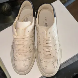 Valentino Cream Sneakers with Minimalist Design and Lace-Up Style